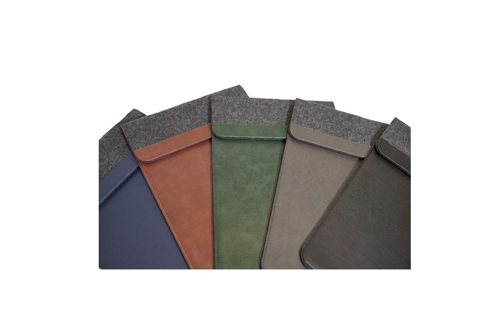 The laptop bag comes in five different colors and has a pocket for storing notes and paper.
